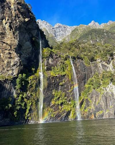 Milford Sound surrounded by mountains in Fiordland New Zealand