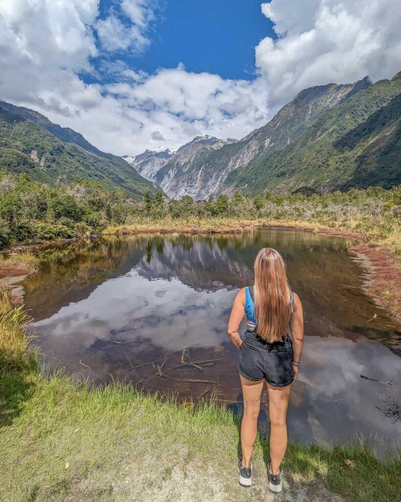 Traveller enjoying a New Zealand mountain landscape