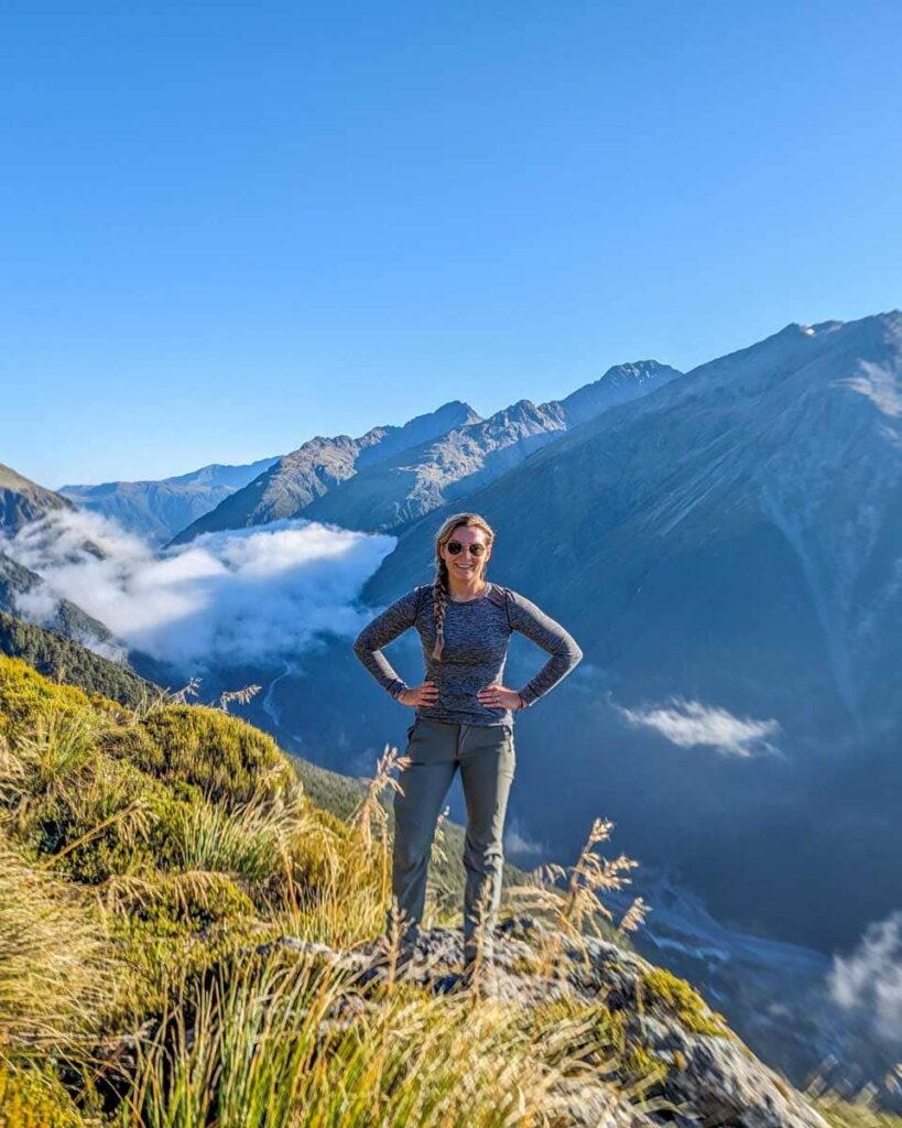 Hiker on a marked trail in New Zealand’s mountains.