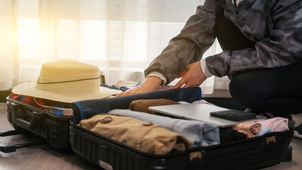 Travel documents and packing essentials for a New Zealand holiday.